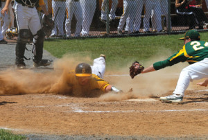 Anthony LaVigne dives safely into home plate and scores for SJV as RBC’s pitcher, Tom Puza, attempts the tag.