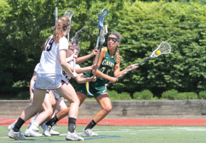 Senior Casey Grace Fallon looks to pass the ball during second-half action. Fallon will be playing lacrosse for Duke next season. --Photo by Sean Simmons