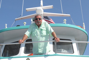 Tom Buban, captain of the Atlantic Star, oversees the morning cruise Monday which brought 30 passengers out into Sandy Hook Bay for 4 ½ hours of fishing. Photo by John Burton
