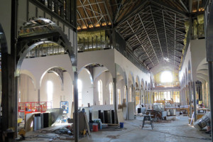  Though lots of work remains, Holy Cross officials are hopeful that construction will be completed by Dec. 23 and a planned Jan. 24 dedication ceremony can be held. This is a view of the church from where the altar will be located. Photo by Michele J. Kuhn