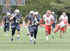 Monmouth University’s Kamau Dumas, No. 24, takes off downfield during the first half against Delaware State at Kessler Field. --Sean Simmons