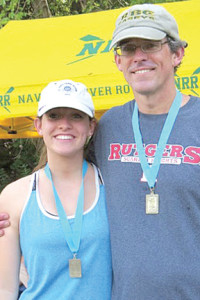 Maeve and Sean Byrnes of Red Bank display the gold medal they won during the Parent/Child double sculls (2X) event Sept. 28 at King’s Head Regatta on the Schuylkill in Bridgeport, Pa.