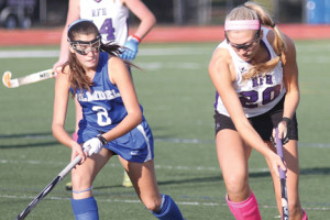 RFH senior captain Catie Ebner, right, looks to get past Holmdel's Chelsea Covino during the first round of the Shore Conference Tournament on Tuesday, Oct. 21. The Lady Bulldogs remain unbeaten with the 8-0 win over Holmdel. --Sean Simmons
