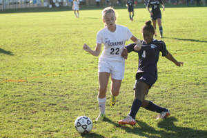 Tara Golding, No. 22 of Mater Dei Prep, and Atheena Dookie, No. 4 of Ranney, battle for the ball.