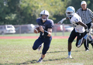 Mater Dei Prep quarterback Christian Palmer, No. 7, rushes for some of his 146 yards during the Seraphs game against Asbury Park. Palmer scored two touchdowns during the 30-20 winning effort. Photo by Sean Simmons