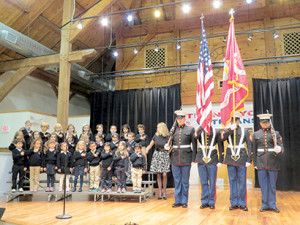 Students at Oak Hill Academy honor veterans during a special Veterans Day program earlier this month that featured the presentation of the colors by the United States Marine Corps Color Guard, 4th Logistic Group. --Courtesy Oak Hill Academy