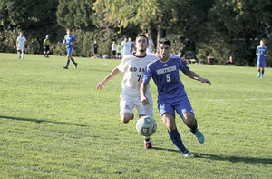 Justin Delaney, No. 7 of Red Bank Regional, and Adam Chodes, No. 5 of Northern Burlington, vie for the ball during Monday's opening round game of the Central Jersey Group III tournament. Delaney scored a goal for the Bucs. --Photos by Sean Simmons