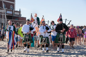 The Sons of the Ireland bagpipers lead the procession of plungers to the ocean. --Tina Colella