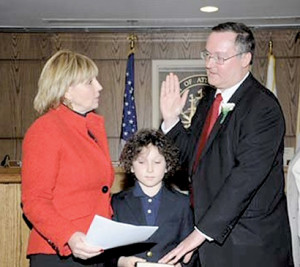 Peter Doyle is sworn in by Lt. Gov. Kim Guadagno. --Courtesy Joseph Barbieri