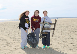 The Clean Ocean Action Beach Sweep drew 4,000 to clean the Jersey Shore on Saturday. Helping in Sea Bright was Regina Molaro of Staten Island and from Middletown, Maria Bonfantino and Tricia Simon. Photo by Patricia Hart Zachman