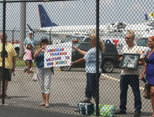 Fans wait at the fence in anticipation of Triple Crown Champion American Pharaoh at Atlantic City Airport in Egg Harbor Township, New Jersey on Wednesday afternoon July 29, 2015 as he arrived from California to the Jersey Shore at Monmouth Park in Oceanport, N.J. American Pharoah, will be the heavy favorite in Sunday's Grade 1 Haskell Invitational.  Photo By Bill Denver/EQUI-PHOTO.