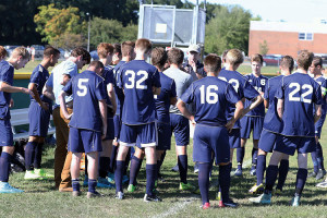 CBA head coach Dan Keane talks to his players prior to Monday's game at Middletown South. Photo by Sean Simmons 
