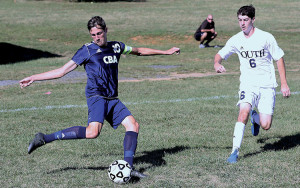 Nicholas Meyer (10) of CBA gets ready to kick the ball as Nick Mihoulides (6) of Middletown South closes in. Meyer scored a goal for the Colts. Photo by Sean Simmons