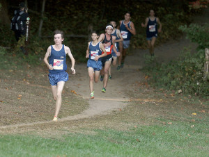 A pack of Christian Brothers Academy runners head out of the woods and towards the finish line. The Colts won their 14th straight Monmouth County crown and 46th overall. Photo: Sean Simmons