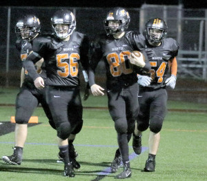 Brock Zenker (80) of Middletown North celebrates after scoring a touchdown on a fumble return. Photo: Sean Simmons