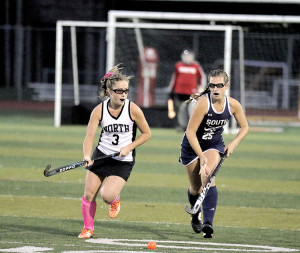 Julia Ferrari (3) of Middletown North and Marissa Colvin (25) of Middletown South battle for the ball. Ferrari scored the only goal of the game during the Lions 1-0 shutout win over the Eagles on Monday night. Photo: Sean Simmons