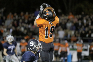 Brendan Kube (19) of Middletown North catches a pass for the Lions. Photo: Sean Simmons