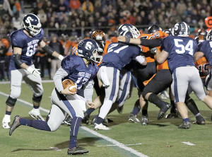 Middletown South quarterback Matt Mosquera (17) picks up good yardage for the Eagles. Photo: Sean Simmons