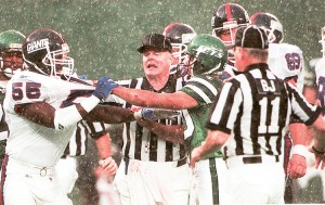 NFL umpire Jim Quirk of Rumson, was always in the middle of the action when tempers flared as they did in this New York Giants, New York Jets game. Photo courtesy Jim Quirk