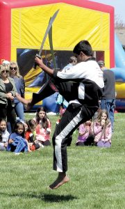 A student at Master Coyne Kumsung Martial Arts, Middletown, performs at Holmdel Community Day.