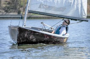 Taugh Lynch, Little Silver, checks sail trim, in his WoodPussy in MBC’s opening day of racing.