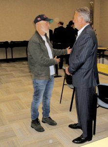 Jon Stewart, left, talks to Colts Neck Deputy Mayor Michael Fitzgerald after the Monmouth County Agriculture Development Board OK an application by Stewart and his wife, Tracey, to operate an agricultural sanctuary-education center in Colts Neck. Photo: Joseph Sapia