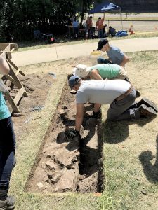 ￼Monmouth University students work on excavation unit five to uncover Revolutionary War artifacts.