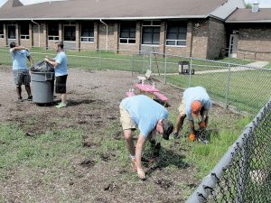 Employees of Goldman Sachs financial services firm volunteered their time last Saturday to help get Red Bank Primary School in shape for the start of the school year.