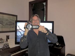 Video historian John Schneider demonstrating his filming techniques during his May 18th Atlantic Highlands Historical presentation on submarine inventor Simon Lake.