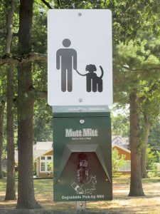 A sign directing the public to dog-waste glove-bags in McCarter Park, Fair Haven.