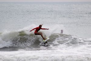 Rumson-Fair Haven freshman Emily Grossrath, a key player in the newly formed RFH Surf Team, catches a wave during practice.