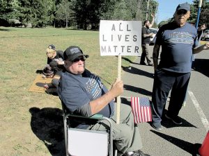 Retired Middletown police officer Ron Chesek participates in a counter demonstration on Sunday expressing his opposition to the controversial Black Lives Matter organization.