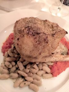 The Swordfish Chop at Fromagerie is served with cannellini beans and sun-dried tomato puree.