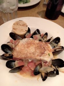 Pan Roasted Grouper is served with steamed PEI mussels. -B. Sacks