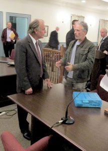 Entertainer Jon Stewart, right, talks with Timothy Anfuso, township planner and zoning officer, after the Colts Neck Planning Board meeting. The board began hearing the application of Stewart and his wife, Tracey, to develop a farm sanctuary-education center on Route 537.