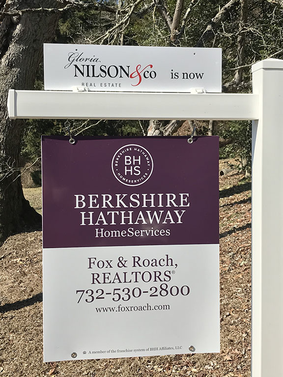 New signs advertise Berkshire Hathaway HomeServices Fox & Roach.