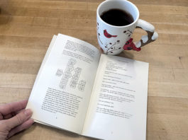 Picture of open cookbook and a mug of tea