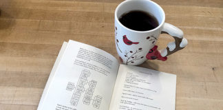 Picture of open cookbook and a mug of tea