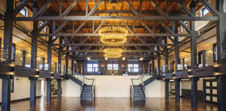 The structure’s original trusses have been incorporated into the design of the main hall, which has new hardwood floors and ample space for dancing.