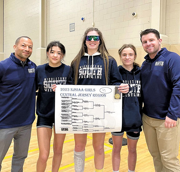 Caitlyn O’Reilly, left, and Thea Rowland, center, earned state medalist honors representing Middletown South at the girls state wrestling championships at Phillipsburg High School. Courtesy Middletown South Athletics