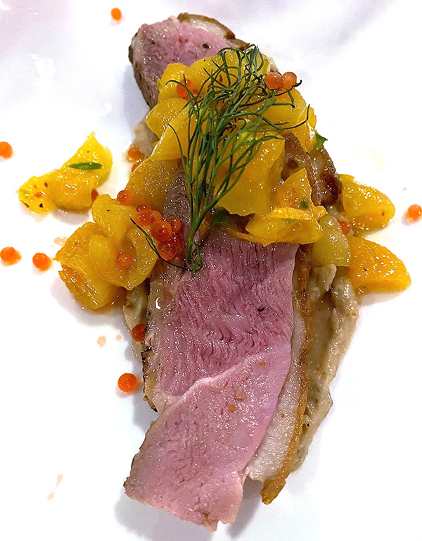 Perfectly rare pan-seared duck breast with apricot, sage and pistachio chutney, was deemed the dish of the night by many guests. Bob Sacks