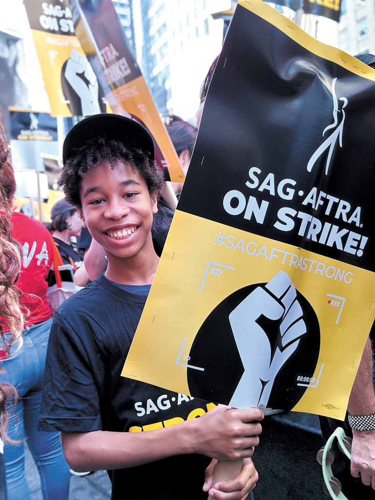 Ian Foreman, a 13-year-old professional actor who often works at Little Silver recording studio PrepNJ, attended the Rock the City for a Fair Contract rally hosted by SAG-AFTRA in Times Square. Tamika Foreman
