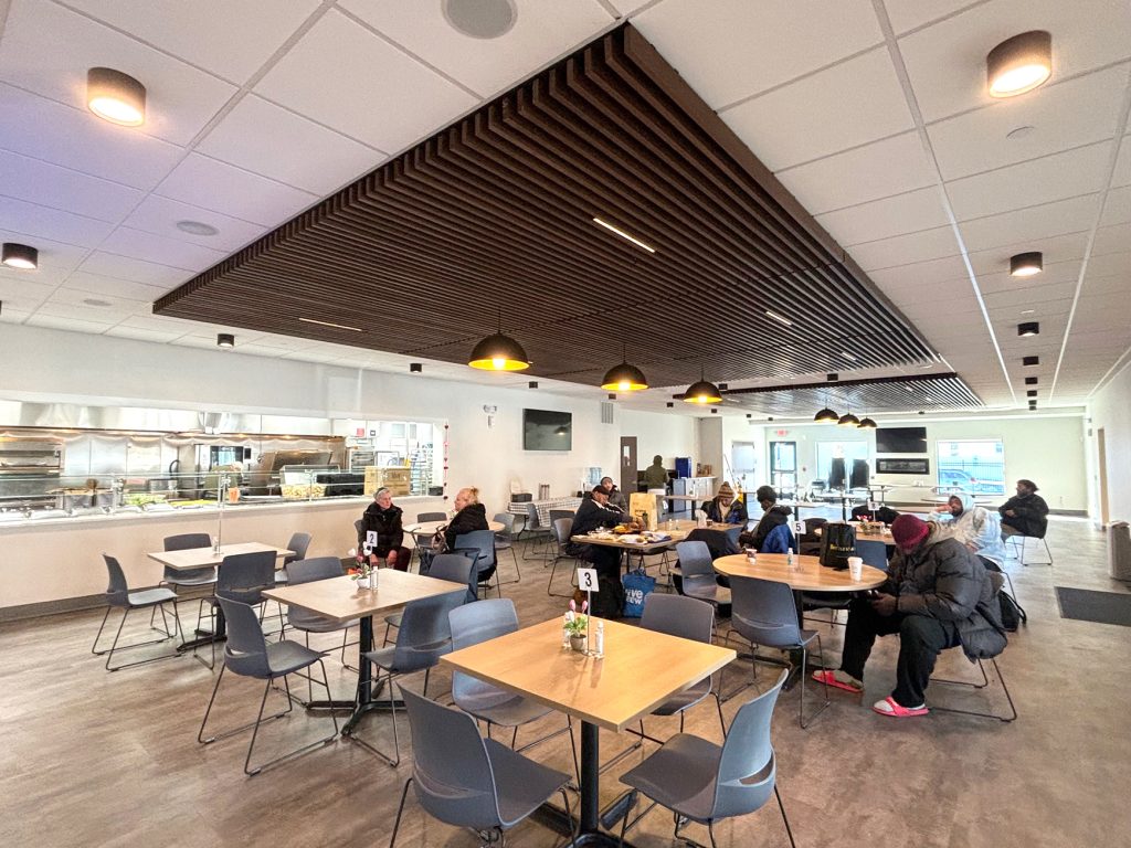 Lunch Break’s new dining hall was designed to be comfortable and welcoming, featuring TVs and a fireplace. Stephen Appezzato